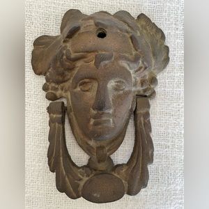 Heavy cast metal doorknocker